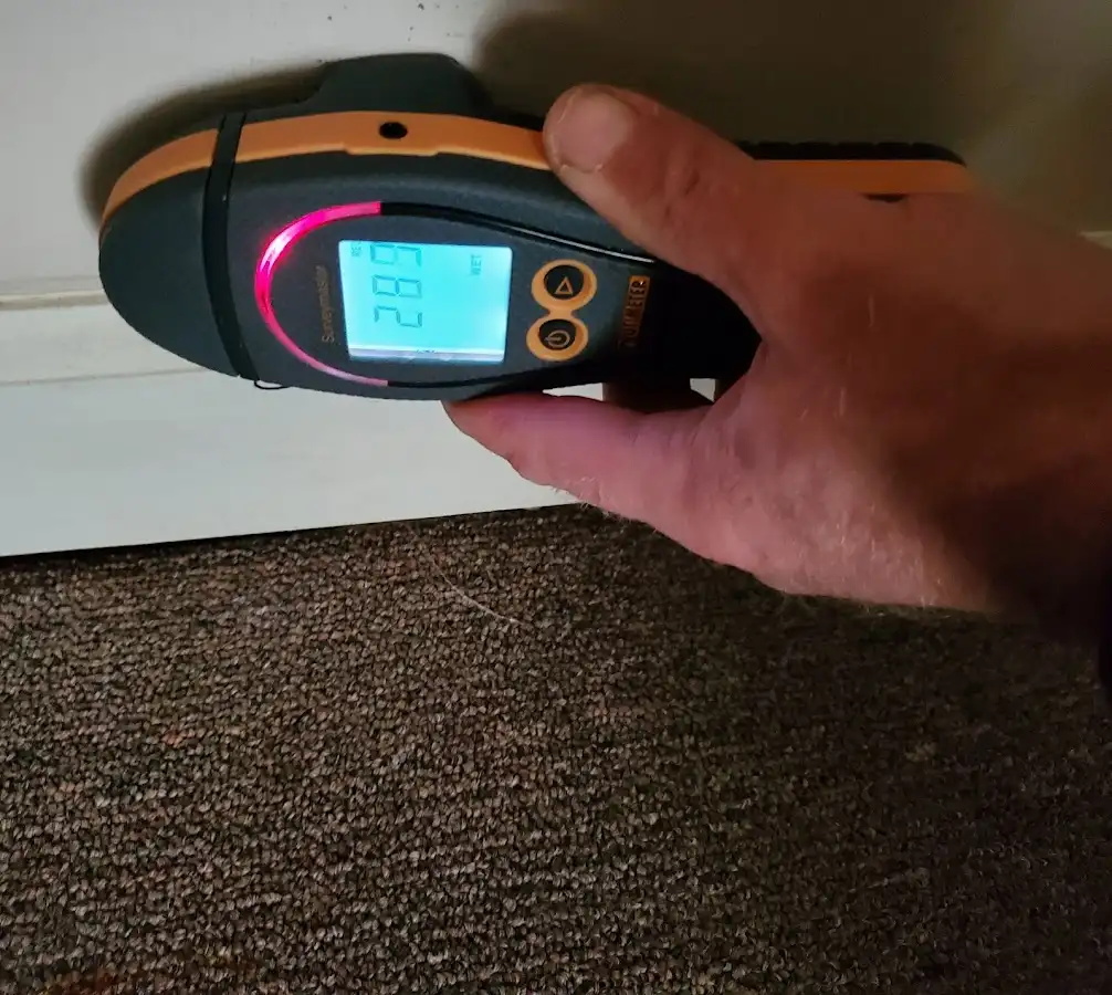 Moisture detection at baseboard during Storm Damage Restoration in Cazenovia
